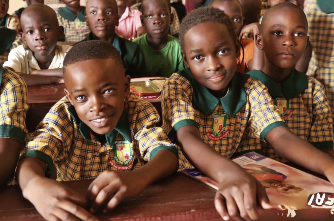 Students seated in a classroom in Uganda
