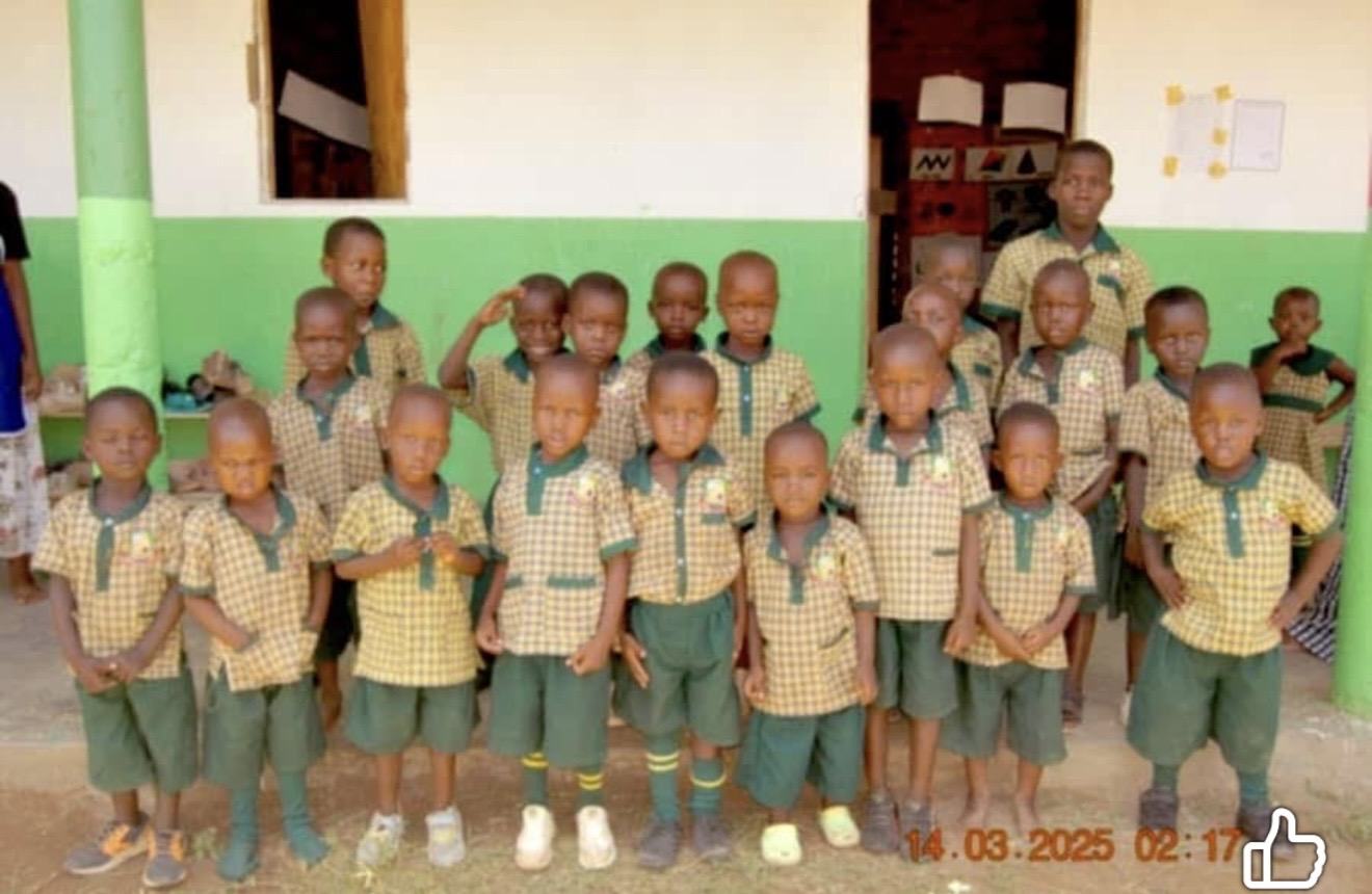 Students standing outside a classroom in Uganda